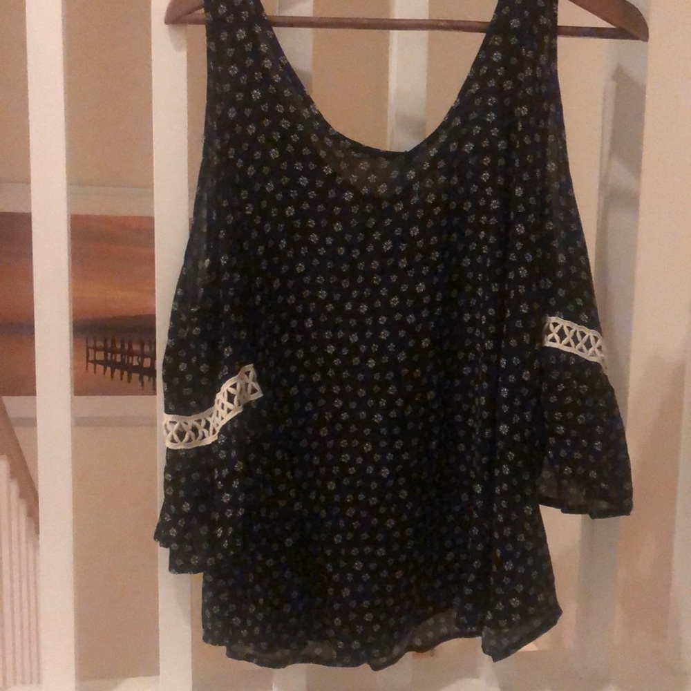 Women’s flowy blouse with cutout shoulders